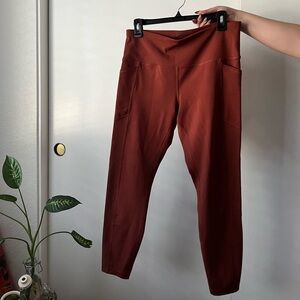 Burnt orange RBX workout leggings with pockets